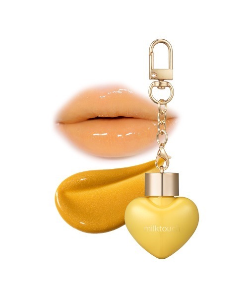 Milk Touch(ミルクタッチ)の「<新発売 / 全8色>ラブポーションシャイングロス(口紅/リップティント/グロス・レディース・01 Mellow Wink/00 Honey Magic/03 Peach Flirting/04 Apple Kiss/02 Pink Me/05 Love Catcher/06 Mauvely/07 Plum Potion・FREE)」の1枚目の写真