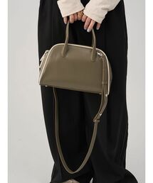 emmi（エミ）の「フェイクレザーパイピングボストンバッグ（ボストンバッグ）」