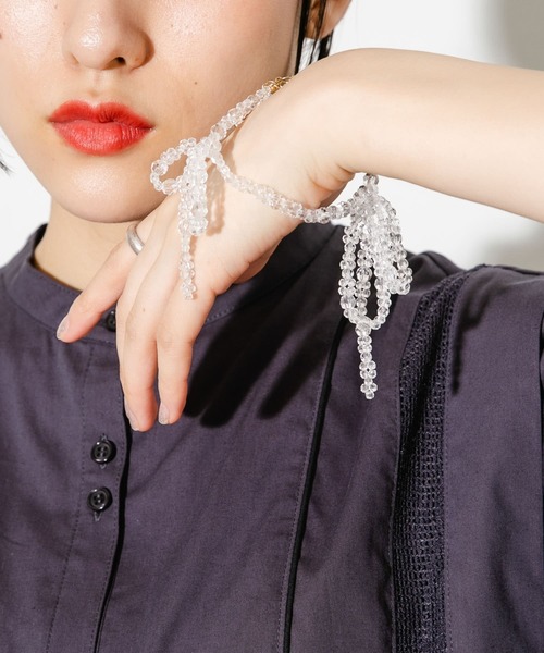 KBF（ケイビーエフ）の「リボンビーズブレスレット（ブレスレット・レディース・オレンジ/クリア・ONE）」の3枚目の写真