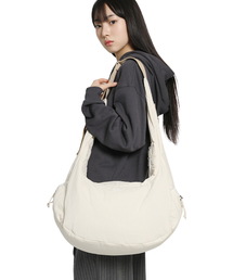 PIECEMAKER（ピースメーカー）の「MULTI POCKET CUSHION CROSS BAG (IVORY)（メッセンジャーバッグ）」