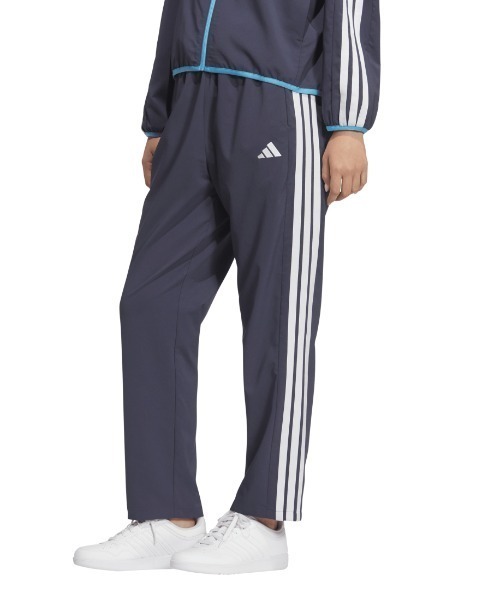 adidas(アディダス)の「アディダス adidas チームス ルーズフィット クロス パンツ(その他パンツ・レディース・ネイビー/ブラック・S/M/L/XL)」の1枚目の写真