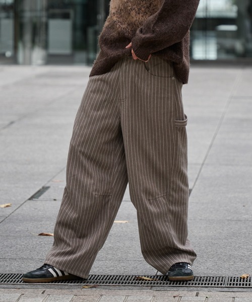 kutir（クティール）の「CURVE PAINTER STRIPE SLACKS PANTS