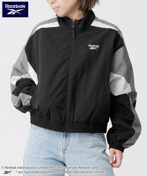 Reebok(リーボック)の「【別注】Reebok/リーボック ブランド ロゴ ワンポイント 配色切替 フルジップ クロップド ナイロン トラックジャケット(ナイロンジャケット・レディース・ネイビー/ブラック・M/L)」の6枚目の写真