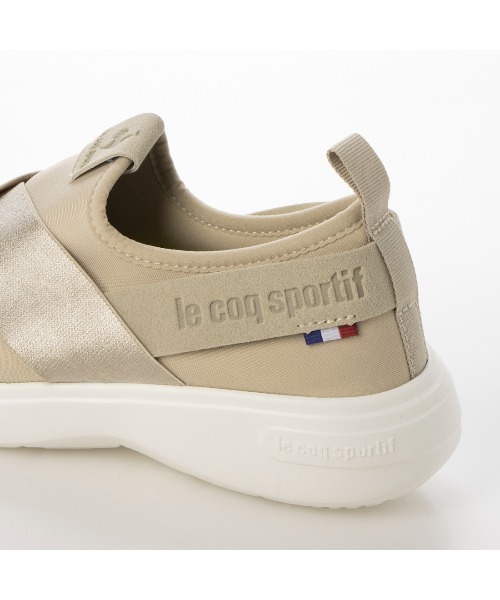 le coq sportif(ルコックスポルティフ)の「クロスベルトスリッポンスニーカー(ラ ローヌ DBSP)(スリッポン・レディース・ベージュ/ブラック/グレー/ブラック×ブラック・24cm/25cm/24.5cm/23cm/22.5cm/23.5cm)」の7枚目の写真