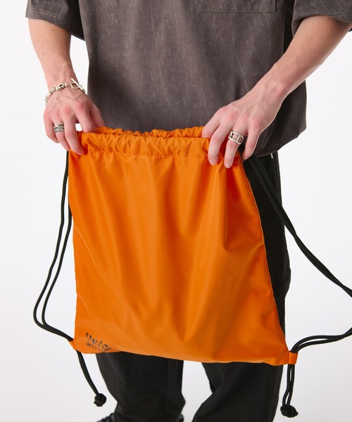 WETTEMPT(ウィテンプト)の「BICOLOR KNAPSACK / バイカラーナップサック(バックパック/リュック・メンズ・オレンジ/ブラック・ONE SIZE)」の17枚目の写真