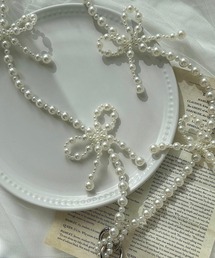 cuorequal（クオレコール）の「パールリボンスマホショルダー（スマホグッズ）」