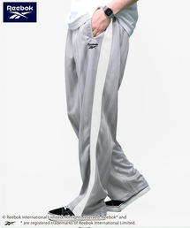 Reebok（リーボック）の「【別注】Reebok/リーボック シャドーストライプジャージ ジャージパンツ トラックパンツ（その他パンツ・メンズ）」