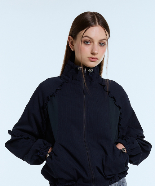 LARTIGENT(ラーティゼン)の「L11 FRILL WINDBREAKER(NAVY)(ナイロンジャケット・レディース・その他・FREE)」の1枚目の写真