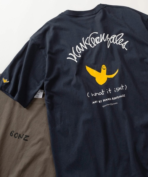 (What it isNt)ART BY MARKGONZALES(ワットイットイズント)の「【75】【(What it isNt) ART BY MARK GONZALES/ワットイズイズント マークゴンザレス】リラックスフィット バックプリントアートグラフィック アソート 半袖Tシャツ/ワンポイント/オーバーサイズ(Tシャツ/カットソー・メンズ・ネイビー/ブラウン/ブラック/チャコールグレー/ホワイト/ホワイト系その他/ブラック系その他/グレー系その他/ブラウン系その他/ブルー系その他/ホワイト系その他2/ホワイト系その他3/ホワイト系その他4/ホワイト系その他5/ブラック系その他2/ブラック系その他3/グレー系その他2/グレー系その他3/グレー系その他4/ブラウン系その他2/ブラウン系その他3/ブラウン系その他4/ブラウン系その他5/ブルー系その他2/ブルー系その他3/ブルー系その他4・M/L/XL)」の22枚目の写真