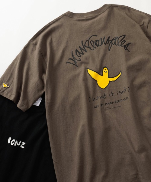 (What it isNt)ART BY MARKGONZALES(ワットイットイズント)の「【75】【(What it isNt) ART BY MARK GONZALES/ワットイズイズント マークゴンザレス】リラックスフィット バックプリントアートグラフィック アソート 半袖Tシャツ/ワンポイント/オーバーサイズ(Tシャツ/カットソー・メンズ・ネイビー/ブラウン/ブラック/チャコールグレー/ホワイト/ホワイト系その他/ブラック系その他/グレー系その他/ブラウン系その他/ブルー系その他/ホワイト系その他2/ホワイト系その他3/ホワイト系その他4/ホワイト系その他5/ブラック系その他2/ブラック系その他3/グレー系その他2/グレー系その他3/グレー系その他4/ブラウン系その他2/ブラウン系その他3/ブラウン系その他4/ブラウン系その他5/ブルー系その他2/ブルー系その他3/ブルー系その他4・M/L/XL)」の16枚目の写真