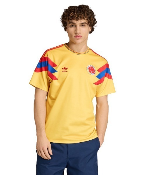 adidas(アディダス)の「adidas originals Colombia National Team 1990 Away Uniform(アディダスオリジナルス コロンビア代表 1990 アウェイ ユニフォーム)(Tシャツ/カットソー・メンズ・イエロー系・SMALL/MEDIUM/X-LARGE/LARGE/XX-LARGE)」の1枚目の写真