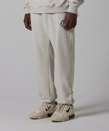 BSMT（ベースメントアーカイブ）の「BSMT Circle Logo Sweat Jogger Pants Oatmeal（スウェットパンツ）」