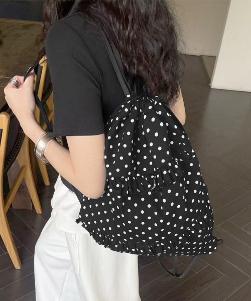 Miniministore(ミニミニストア)の「ドット柄ナップサックフリル巾着バッグ軽量(バックパック/リュック・レディース・ホワイト/ブラック・FREE)」の1枚目の写真